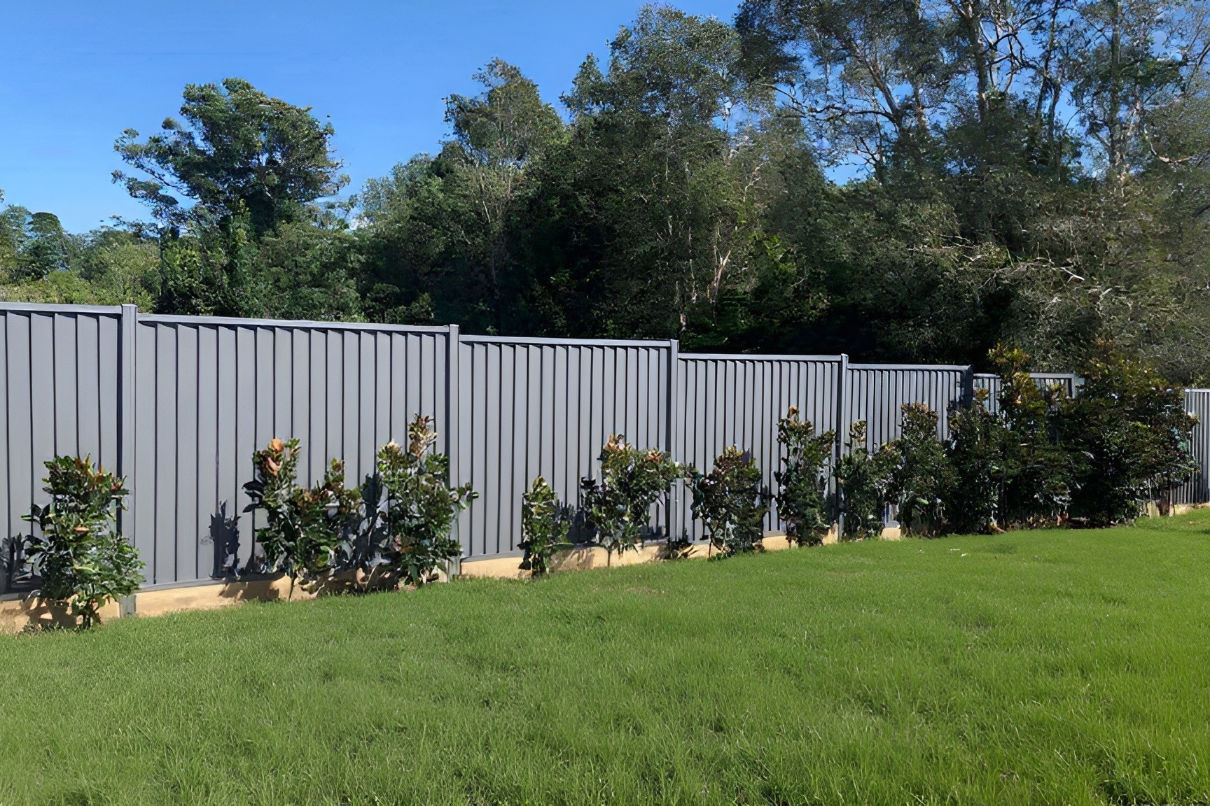 add lush green grass around fence 3to2